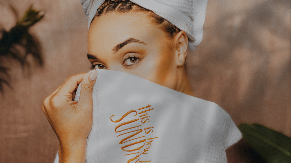 Luxe white robe with model hiding eye