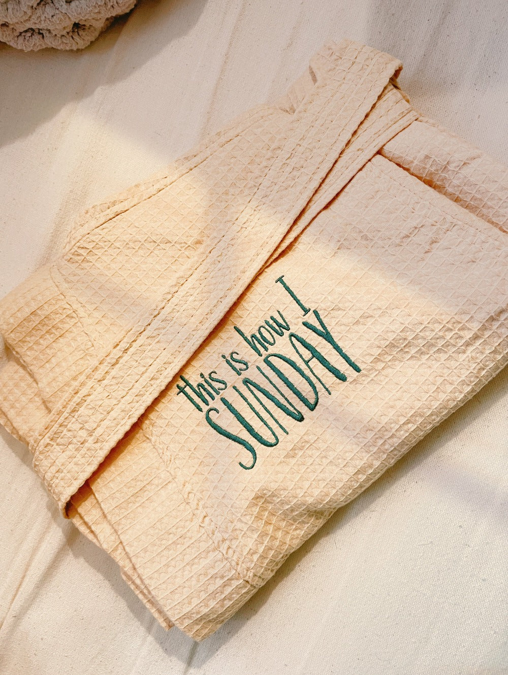 Beige luxury waffle robe with Sunday logo Embroidery lifestyle photo